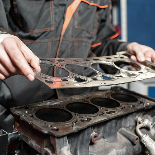 Mechanic replacing the whole gasket kits on a Toyota forklift engine
